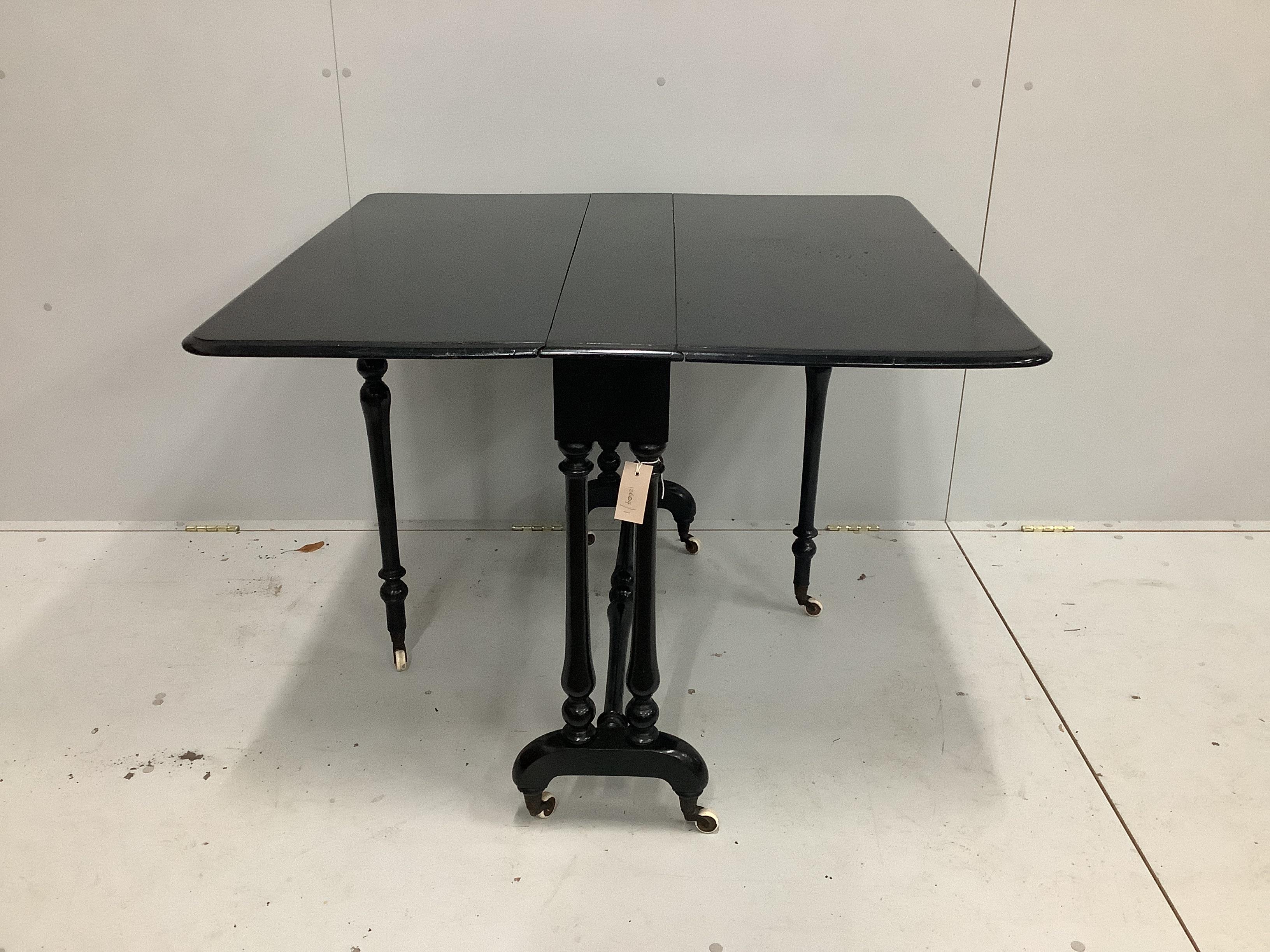 A 19th century ebonised Sutherland table, width 90cm, depth 17cm, height 72cm